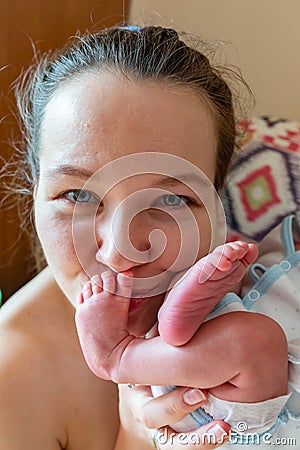 Mother and Baby kissing and hugging. Happy Family Stock Photo