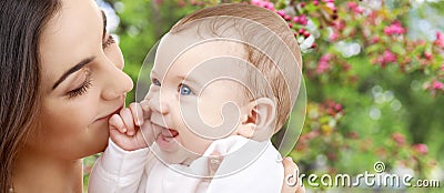 Mother with baby over spring garden background Stock Photo