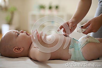 Young mother and baby, skin care. Close up. Stock Photo