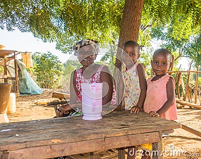 Kenyan Giriama farmer mother with two children Editorial Stock Photo