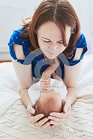Mother bonding with her newborn baby Stock Photo