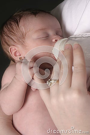 Mother Bottle Feeding Stock Photo