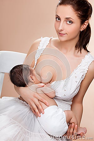 Mother breast feeding her child Stock Photo