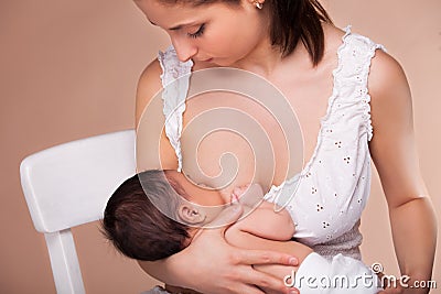 Mother breast feeding her child Stock Photo