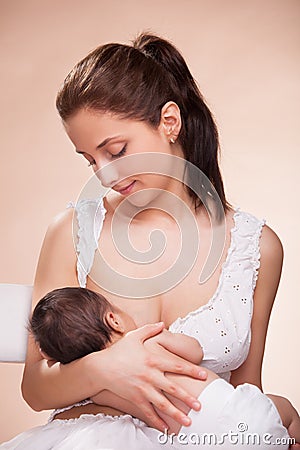 Mother breast feeding her child Stock Photo