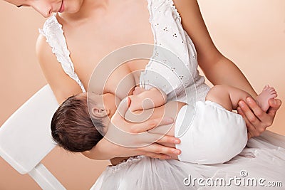 Mother breast feeding her child Stock Photo