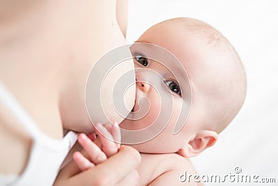 Mother breast feeding her infant baby Stock Photo