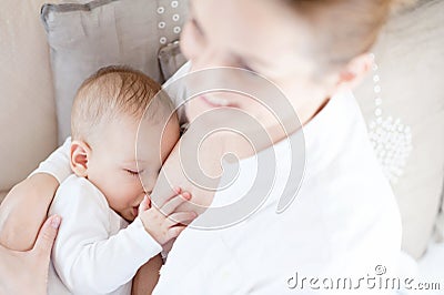 Mother breast feeding her infant Stock Photo