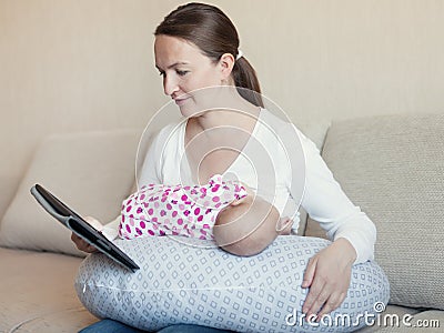 Mother breast feeding her infant Stock Photo