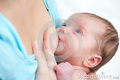 Mother breast feeding newborn baby Stock Photo