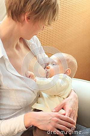 Mother breastfeeding baby Stock Photo