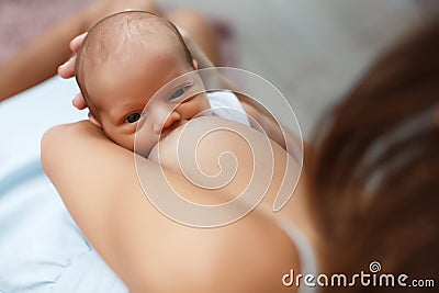 Mother breastfeeding her newborn child Stock Photo
