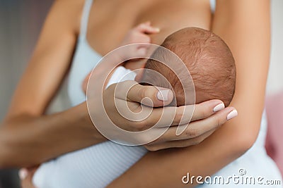 Mother breastfeeding her newborn child Stock Photo