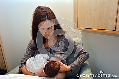 Mother Breastfeeding her Newborn Stock Photo