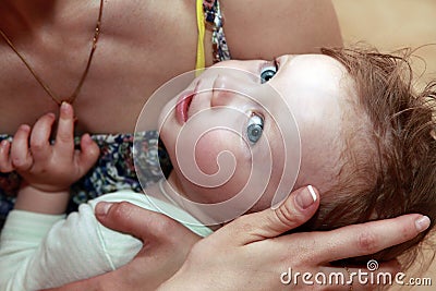 Mother calms his baby daughter Stock Photo