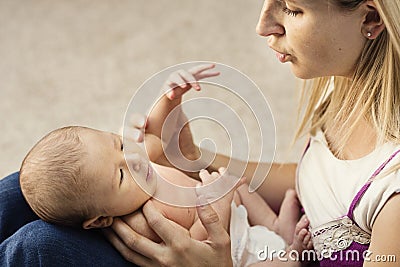 Mother caring for small baby Stock Photo