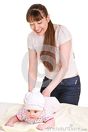 Mother changing babies cloth diaper. Stock Photo