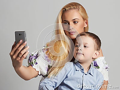 Mother and Child. Beautiful Blond Woman with Little Son. Happy Family Stock Photo