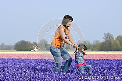Mother and child in colorful bulb field Editorial Stock Photo