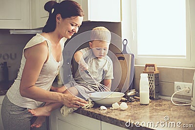 Mother with child cooking together Stock Photo