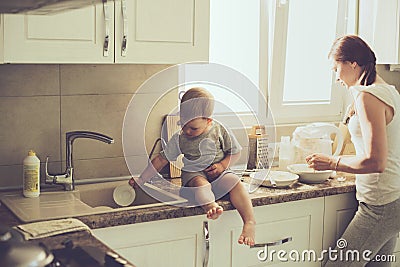 Mother with child cooking together Stock Photo