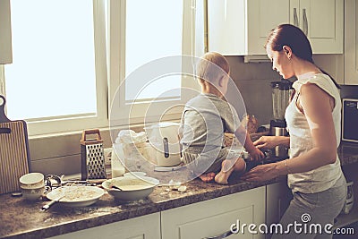 Mother with child cooking together Stock Photo