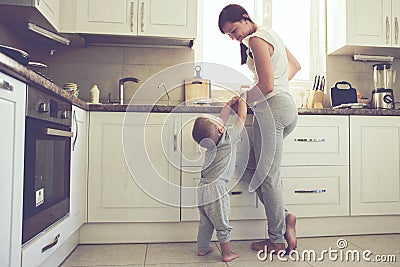 Mother with child cooking together Stock Photo