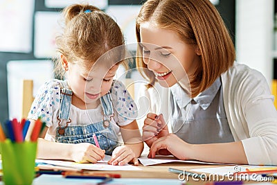 Mother and child daughter draws in creativity in kindergarten Stock Photo