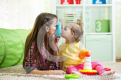 Mother with child daughter play Stock Photo