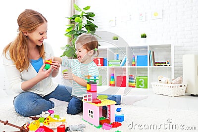 Mother and child daughter playing, build from constructor Stock Photo