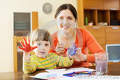 Mother and child drawing with hand printing Stock Photo
