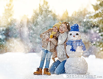Mother and child girl on a winter walk Stock Photo