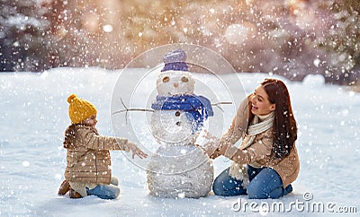 Mother and child girl on a winter walk in nature Stock Photo