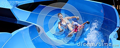 Mother and child having fun in water park Stock Photo