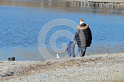 Mother with child at the lake 1 Stock Photo
