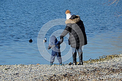 Mother with child at the lake 4 Stock Photo