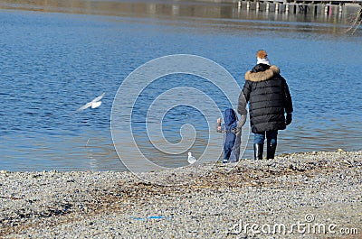 Mother with child at the lake 2 Stock Photo