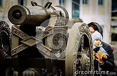 A mother and child near the old cannons. Editorial Stock Photo