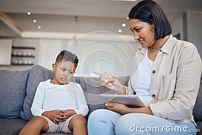 Mother, child and scolding or discipline, tablet and punishment at home. Parent and daughter, communication and Stock Photo