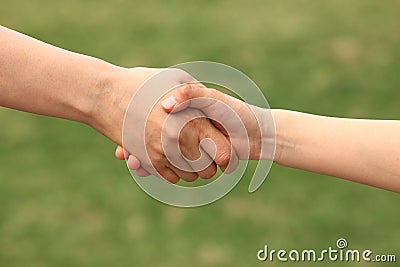 Mother and child shake hands Stock Photo