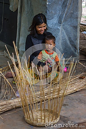 Mother and child sitting in their Cambodian village Editorial Stock Photo