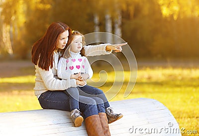 Mother and child walking on autumn day Stock Photo