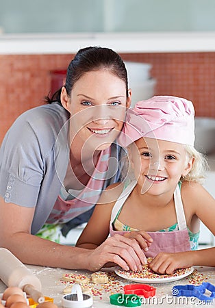 Mother and childing in Kitchen Smiling at Camera Stock Photo