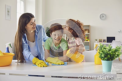 Mother and children are cleaning the house. Stock Photo
