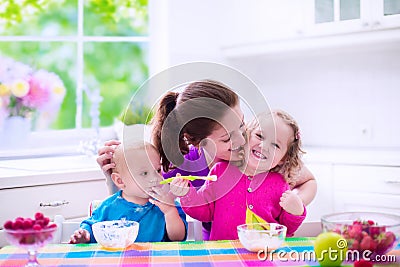 Mother and children having breakfast Stock Photo