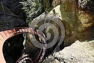 Mother with children walking in metal stairs in Liechtensteinklamm or Liechtenstein Gorge, Austria Stock Photo