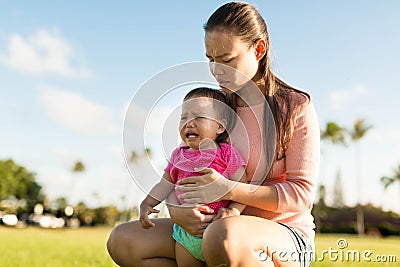 Mother comforting her young upset daughter Stock Photo