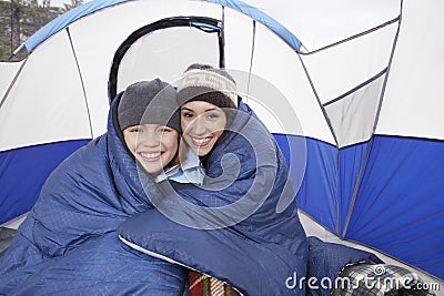 Mother And Daughter Camping In Winter Stock Photo