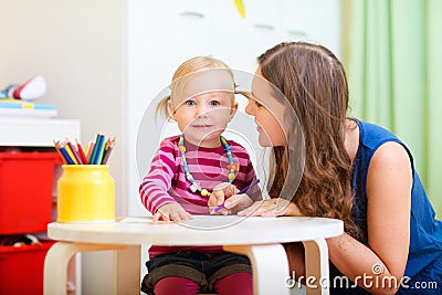 Mother and daughter drawing together Stock Photo