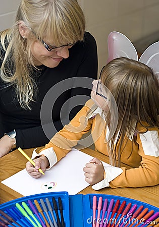 Mother and daughter drawing together Stock Photo